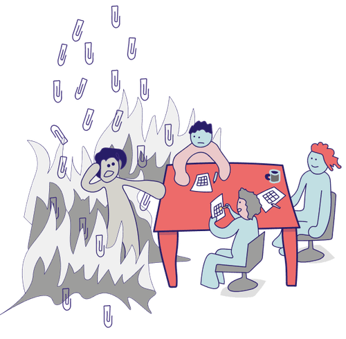 Vier Menschen sitzen bzw. stehen um einen Tisch und spielen Krisen-Bingo.